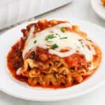 A serving of lasagna rollups on a plate.