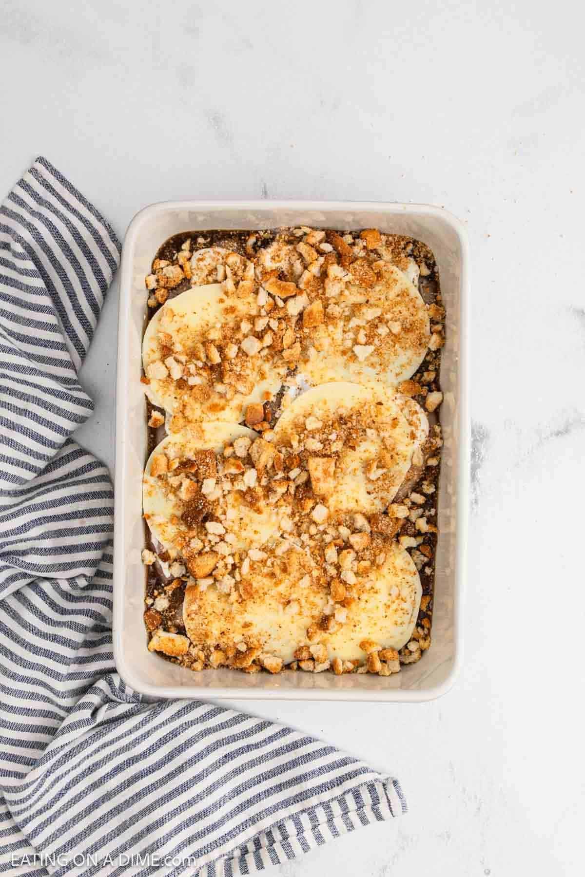 Crushed croutons and slice provolone cheese over the chicken breasts.